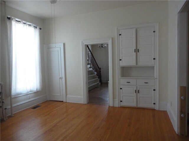 161 Ord St, Salisbury, PA 15558 - spare room featuring baseboards, stairs, visible vents, and light wood finished floors