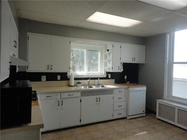 161 Ord St, Salisbury, PA 15558 - kitchen featuring dishwasher, radiator heating unit, white cabinetry, a sink, and a paneled ceiling