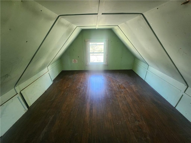 bonus room featuring lofted ceiling and wood finished floors