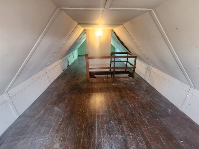 bonus room featuring lofted ceiling and wood-type flooring