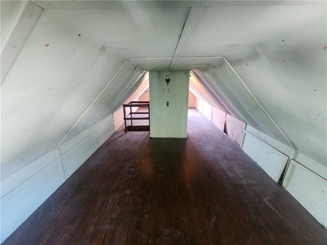 bonus room with vaulted ceiling and wood finished floors