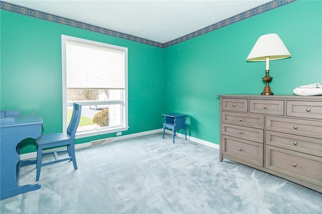 interior space featuring visible vents, baseboards, and light carpet