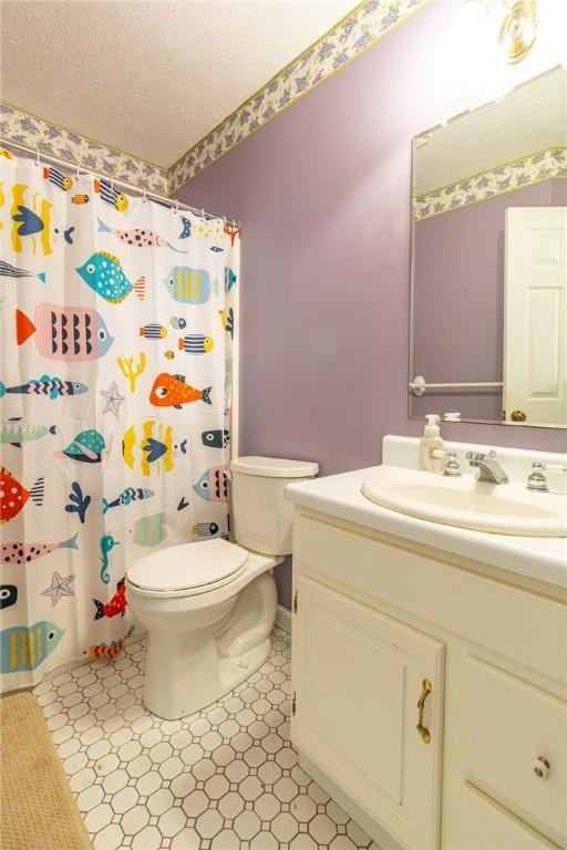 bathroom with a textured ceiling, toilet, baseboards, curtained shower, and vanity
