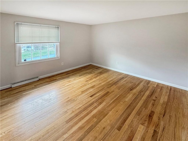 1248 Satellite Cir, Upper St Clair, PA 15241 - spare room featuring a baseboard radiator and light wood-style floors