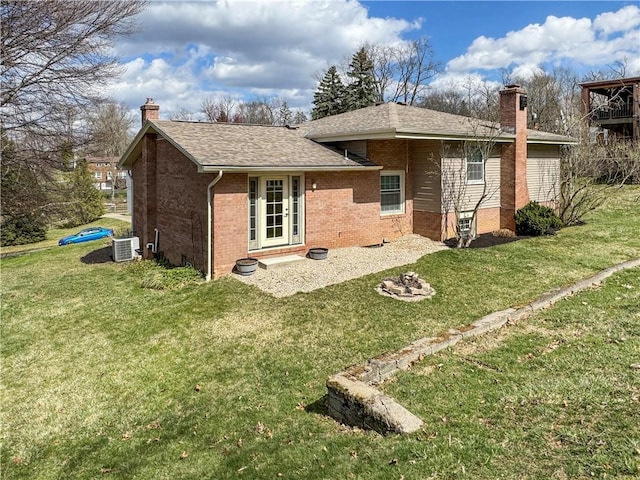 1248 Satellite Cir, Upper St Clair, PA 15241 - rear view of house with a chimney, brick siding, and a yard