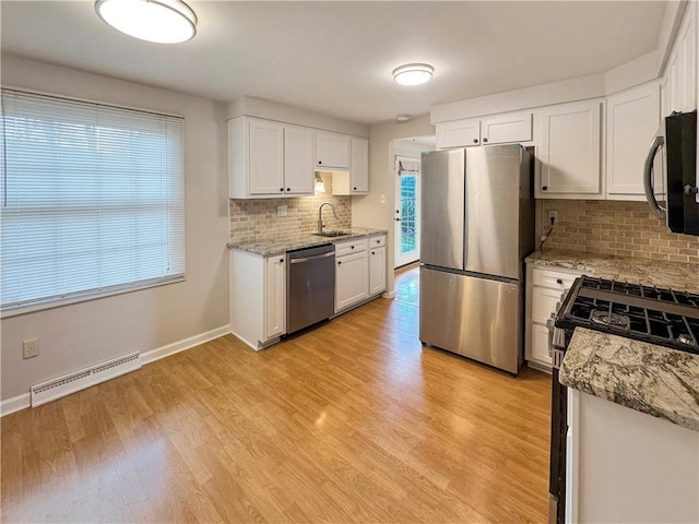1248 Satellite Cir, Upper St Clair, PA 15241 - kitchen with stainless steel appliances, decorative backsplash, and light wood-style floors