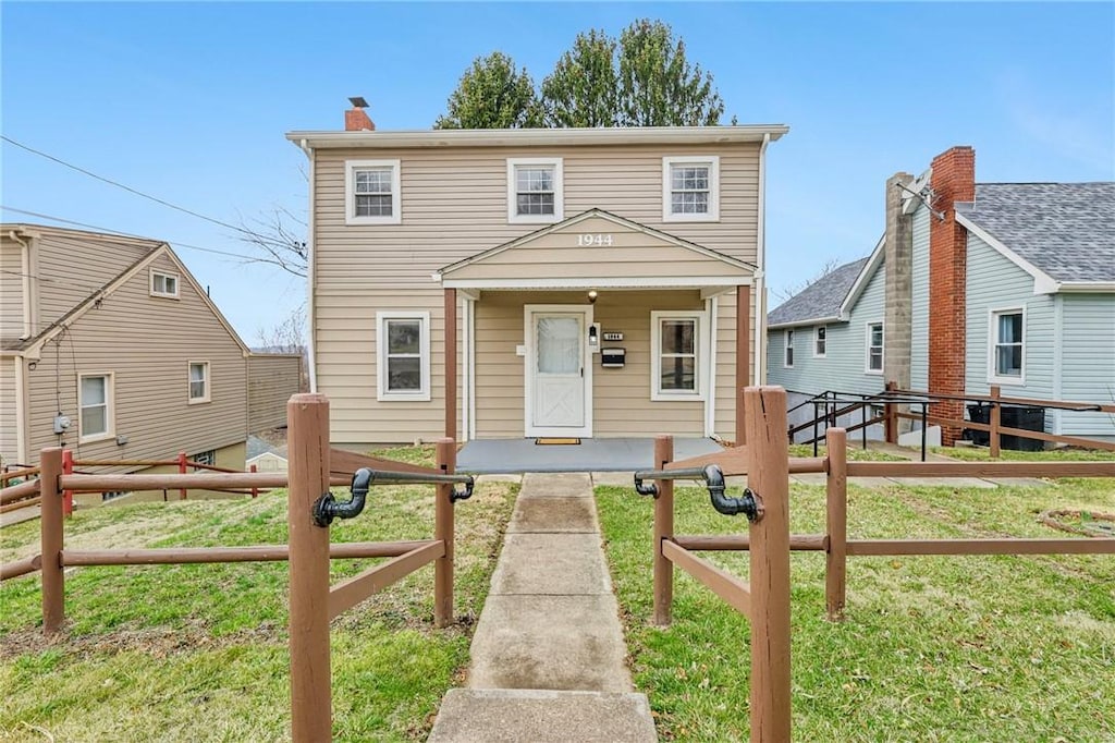 1944 Addison Ave, West Mifflin, PA 15122 - view of front of home with a chimney, a front yard, and fence