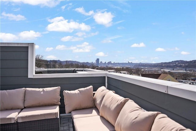 balcony with a view of city and outdoor lounge area