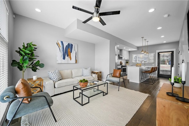 living area featuring recessed lighting, dark wood-style floors, and ceiling fan