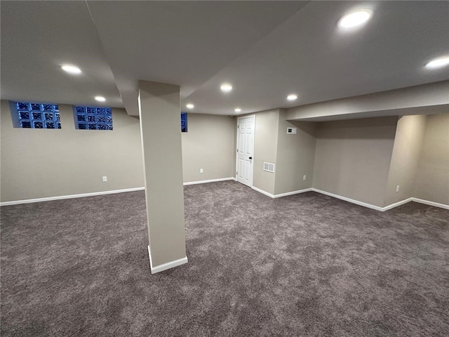 finished basement with recessed lighting, baseboards, dark colored carpet, and visible vents