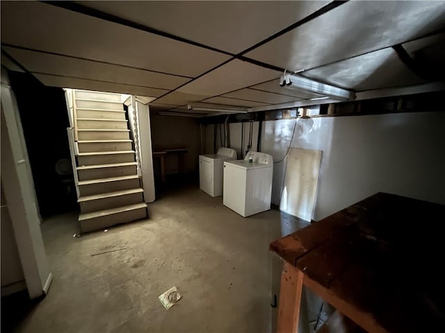 unfinished below grade area with washer and dryer and stairway
