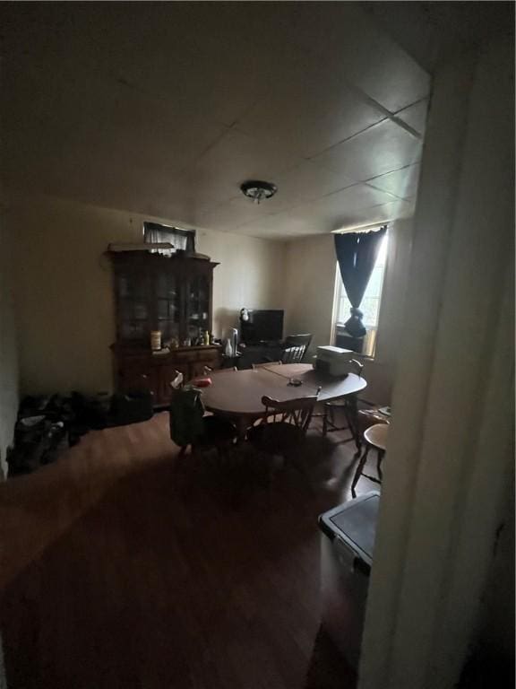 dining area with wood finished floors
