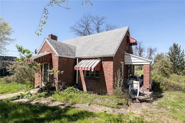 321 Apache Dr, Monessen, PA 15062 - view of property exterior with brick siding, a chimney, and a shingled roof