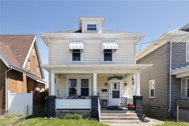 1008 Athalia Ave, Monessen, PA 15062 - american foursquare style home with a porch and fence