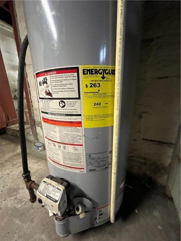 utility room featuring water heater