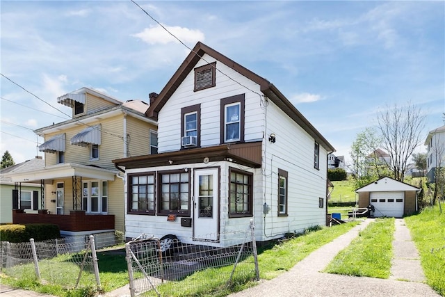 view of front of property with driveway, a garage, fence, an outbuilding, and cooling unit