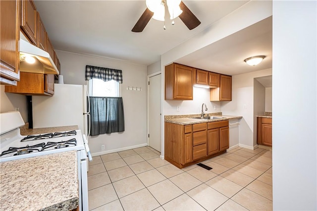 719 Zimmerman St, Jeannette, PA 15644 - kitchen featuring gas range gas stove, ceiling fan, light countertops, and brown cabinetry