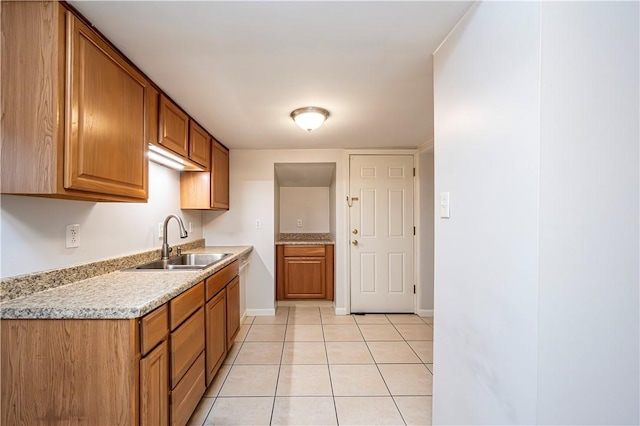 719 Zimmerman St, Jeannette, PA 15644 - kitchen featuring light countertops, brown cabinetry, and light tile patterned floors
