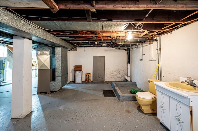 719 Zimmerman St, Jeannette, PA 15644 - below grade area with a sink and heating unit