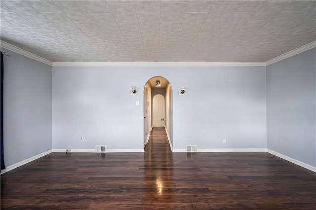 719 Zimmerman St, Jeannette, PA 15644 - unfurnished room featuring arched walkways, wood finished floors, and ornamental molding