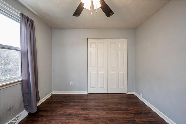 719 Zimmerman St, Jeannette, PA 15644 - unfurnished bedroom with dark wood-type flooring, a closet, and ceiling fan