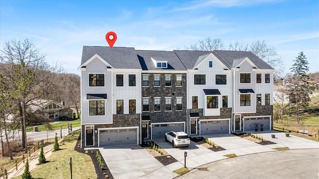 111 Quail Run Rd Unit 1, Peters Twp, PA 15367 - view of property with concrete driveway, stone siding, and a garage