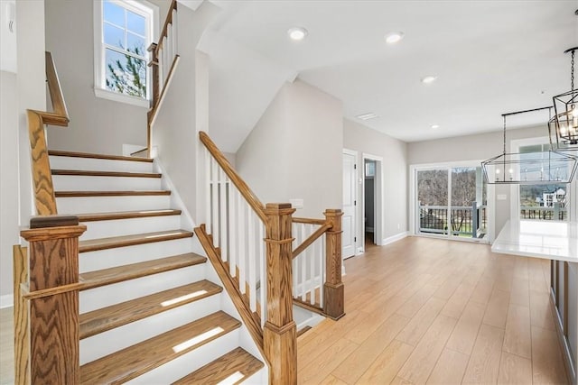 111 Quail Run Rd Unit 1, Peters Twp, PA 15367 - staircase featuring a chandelier, baseboards, wood finished floors, and recessed lighting