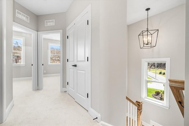 111 Quail Run Rd Unit 1, Peters Twp, PA 15367 - hall with a chandelier, light colored carpet, and baseboards