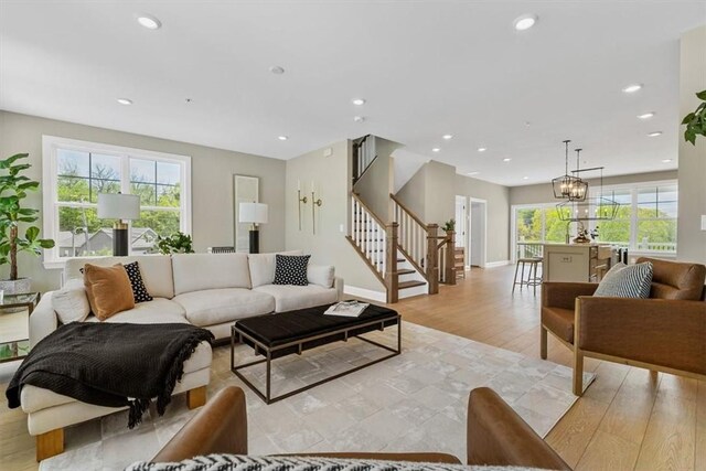 111 Quail Run Rd Unit 1, Peters Twp, PA 15367 - living room with stairs, light wood-style flooring, and recessed lighting