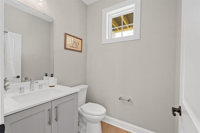 111 Quail Run Rd Unit 1, Peters Twp, PA 15367 - bathroom with toilet, vanity, wood finished floors, and baseboards