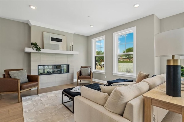 111 Quail Run Rd Unit 1, Peters Twp, PA 15367 - living area with a tiled fireplace, recessed lighting, light wood-style floors, and baseboards