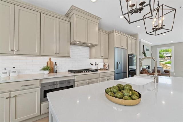 111 Quail Run Rd Unit 1, Peters Twp, PA 15367 - kitchen featuring built in fridge, a chandelier, light countertops, stainless steel gas cooktop, and backsplash