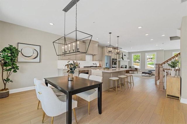 111 Quail Run Rd Unit 1, Peters Twp, PA 15367 - dining area with baseboards, light wood-style flooring, recessed lighting, and a chandelier
