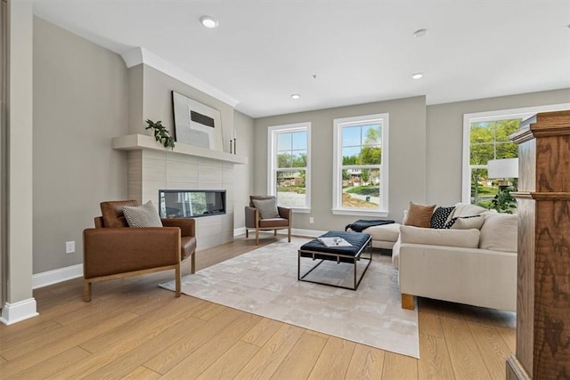 111 Quail Run Rd Unit 1, Peters Twp, PA 15367 - living area featuring light wood-type flooring, baseboards, a tile fireplace, and recessed lighting