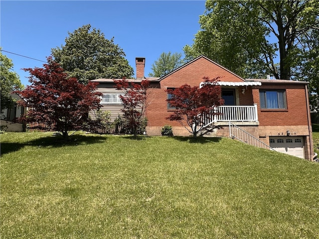 4517 Lebanon Church Rd, West Mifflin, PA 15122 - view of front of home featuring an attached garage, a front lawn, brick siding, a chimney, and covered porch
