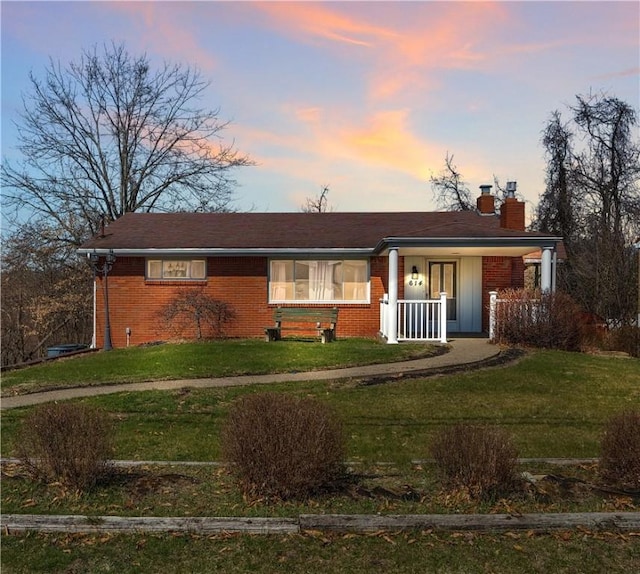 614 Tartan Dr, Monroeville, PA 15146 - ranch-style house featuring a chimney, a front lawn, a porch, and brick siding