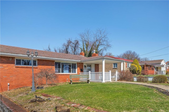 614 Tartan Dr, Monroeville, PA 15146 - single story home with a front lawn, a chimney, a porch, and brick siding