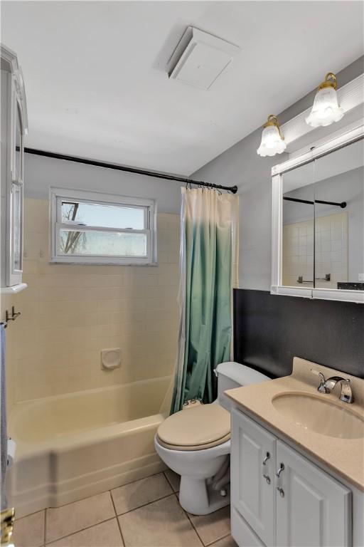 614 Tartan Dr, Monroeville, PA 15146 - full bathroom featuring vanity, toilet, tile patterned flooring, and shower / tub combo with curtain