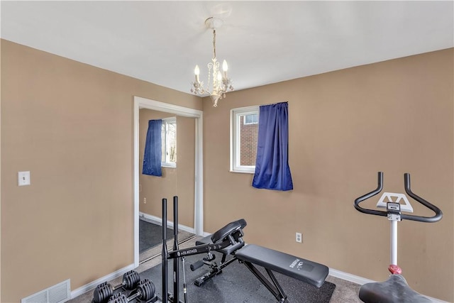 614 Tartan Dr, Monroeville, PA 15146 - workout room with baseboards, visible vents, and an inviting chandelier