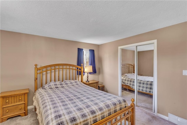 614 Tartan Dr, Monroeville, PA 15146 - bedroom featuring visible vents, a closet, carpet flooring, and a textured ceiling