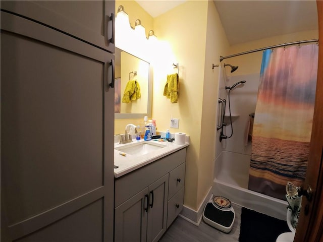 418 Pine Hill Rd, W Kittanning Boro, PA 16201 - bathroom featuring wood finished floors, baseboards, vanity, and shower / bath combo with shower curtain
