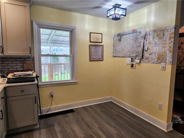 418 Pine Hill Rd, W Kittanning Boro, PA 16201 - unfurnished dining area with plenty of natural light, baseboards, and dark wood finished floors