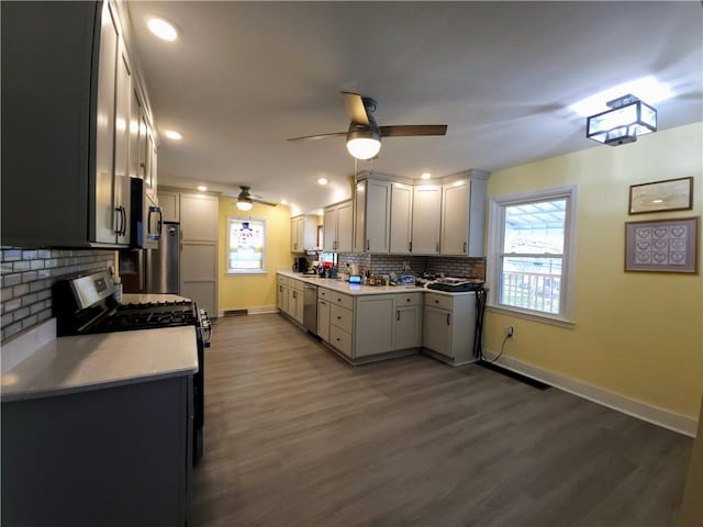 418 Pine Hill Rd, W Kittanning Boro, PA 16201 - kitchen featuring stainless steel appliances, wood finished floors, ceiling fan, and tasteful backsplash