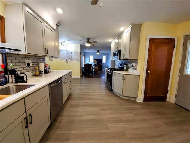 418 Pine Hill Rd, W Kittanning Boro, PA 16201 - kitchen featuring recessed lighting, backsplash, light wood-type flooring, appliances with stainless steel finishes, and ceiling fan