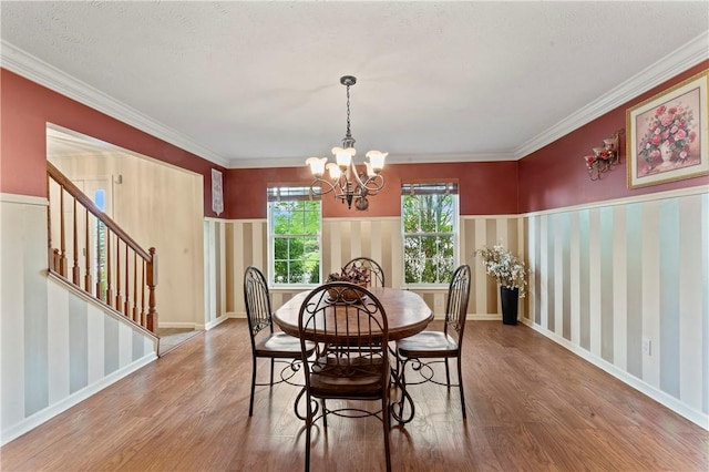 505 Luke Ct, Cranberry Twp, PA 16066 - dining room featuring wood finished floors, a chandelier, stairway, crown molding, and baseboards