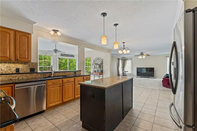 505 Luke Ct, Cranberry Twp, PA 16066 - kitchen featuring stainless steel appliances, a ceiling fan, a sink, light tile patterned floors, and crown molding