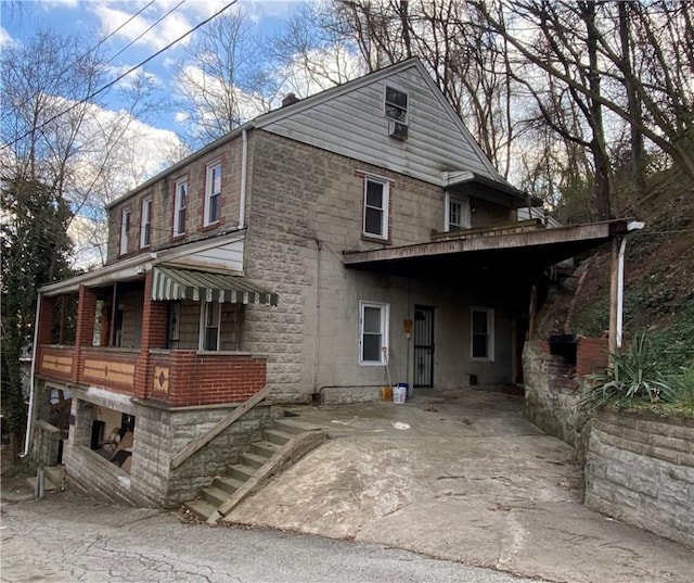 exterior space featuring stone siding