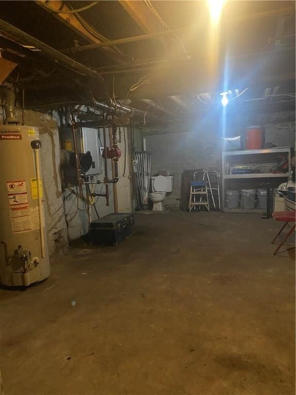 unfinished basement featuring water heater