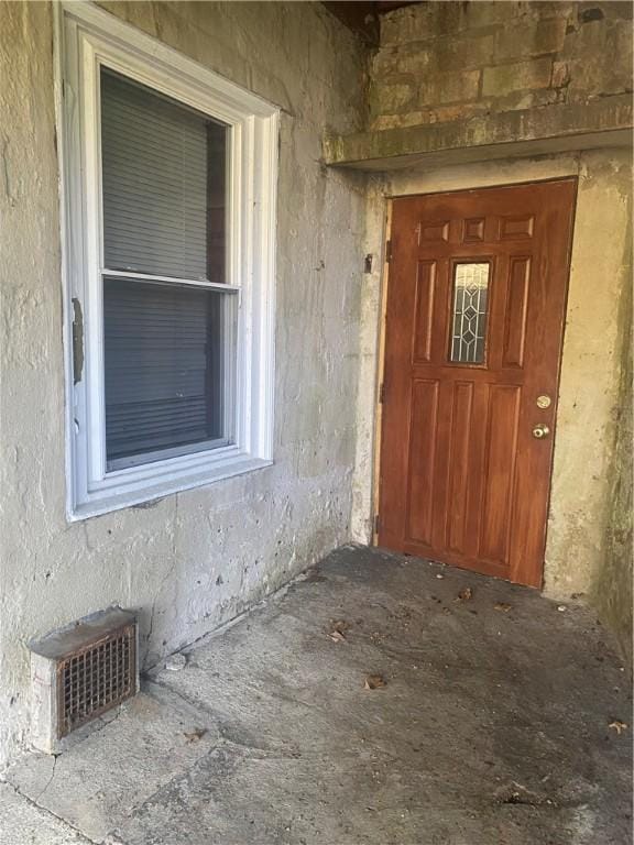 view of exterior entry featuring visible vents