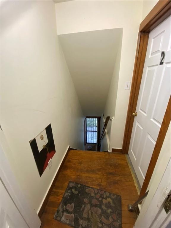 stairs with baseboards and hardwood / wood-style flooring